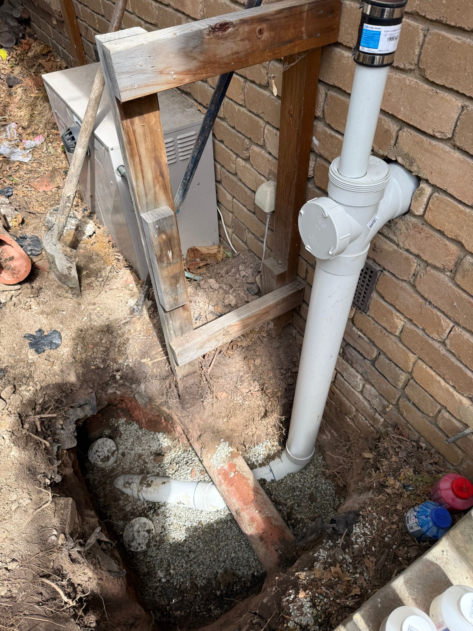 Sewer excavation with timber shoring and new PVC pipe connection Melbourne
